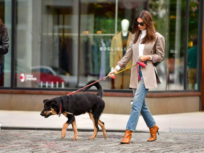 When fall rolled around, she paired a different blazer with a white turtleneck, light-wash jeans, and brown leather boots with thin heels.