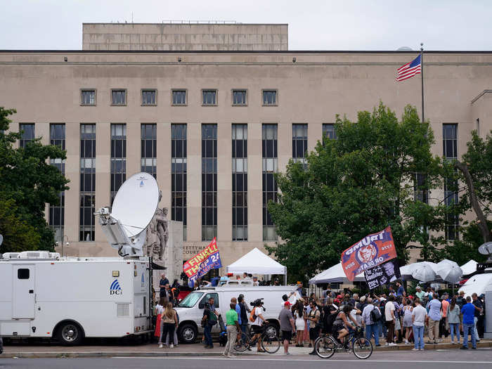 Media members and demonstrators gathered outside the courthouse. Some reporters waited since Wednesday to get a coveted seat inside the courtroom.