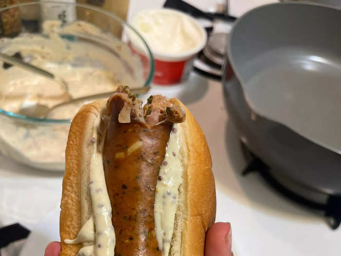 I smothered the sauce on a hot-dog bun and placed the chicken sausage inside.