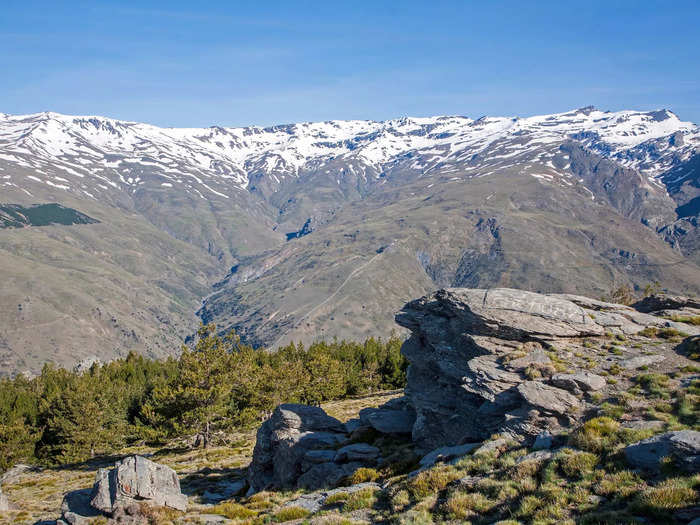 The acequias take water from snowmelt and precipitation up in the hills and mountains of Spain.