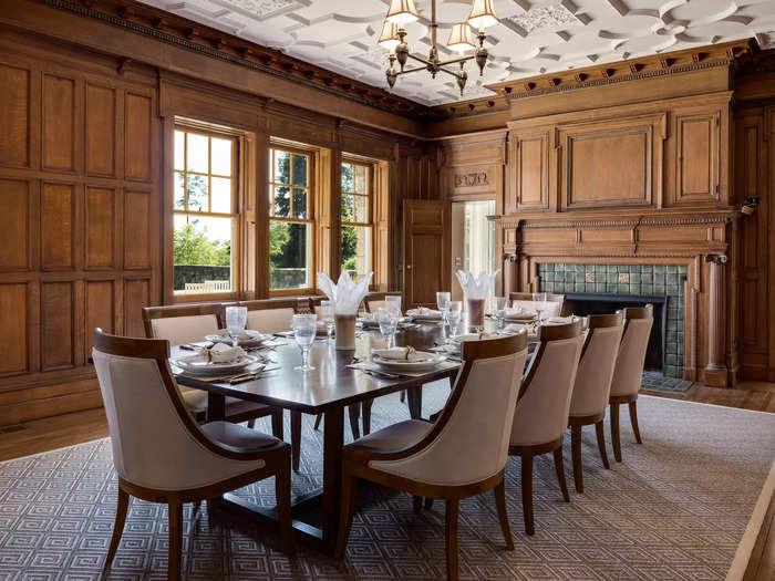 For more formal occasions, the wood-paneled dining room with its intricate plaster ceiling has plenty of space for dinner guests.