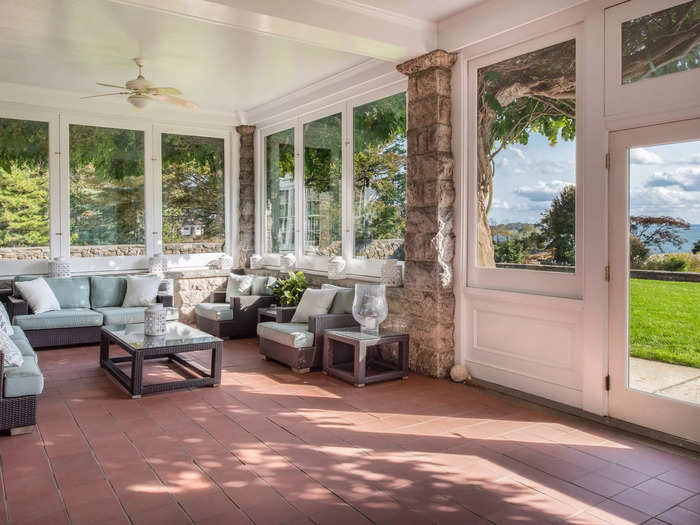 The house has a screened porch to enjoy the sun and views of the property