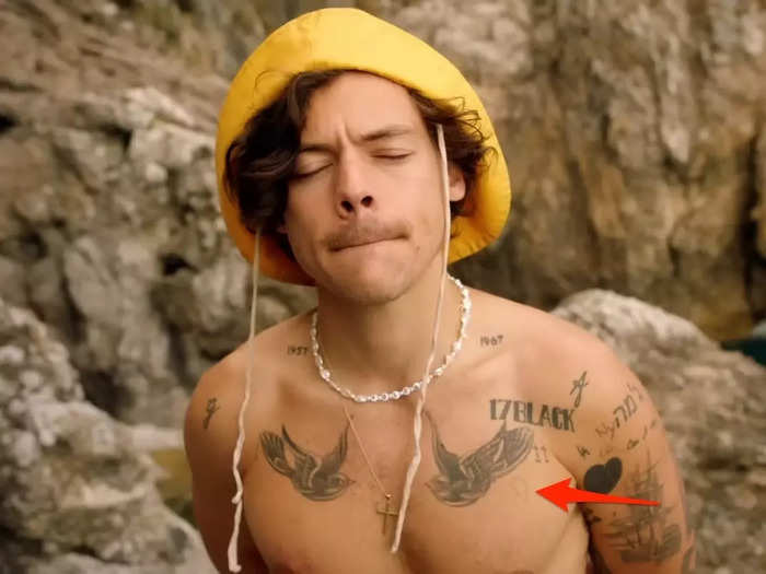 Styles has the outline of half of a broken heart on his chest.