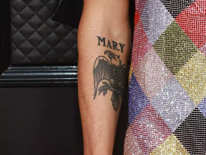 Later, Styles added the name Mary above the eagle tattoo.