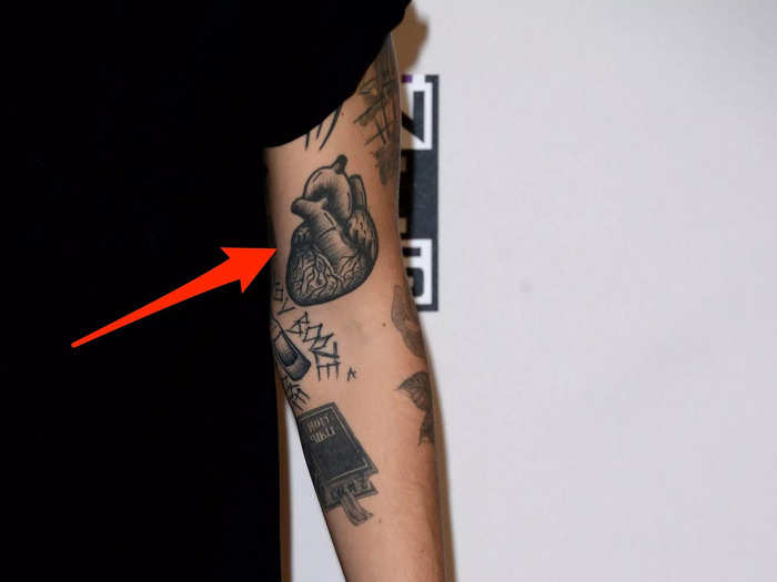 His left arm also has an anatomical heart.