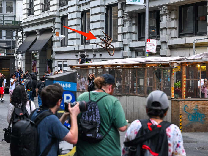 Fans appear to have thrown a restaurant chair, too.