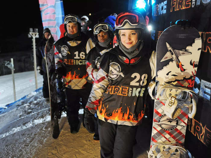 Two snowboarders overcome obstacles in "Cloud 9" (2014).