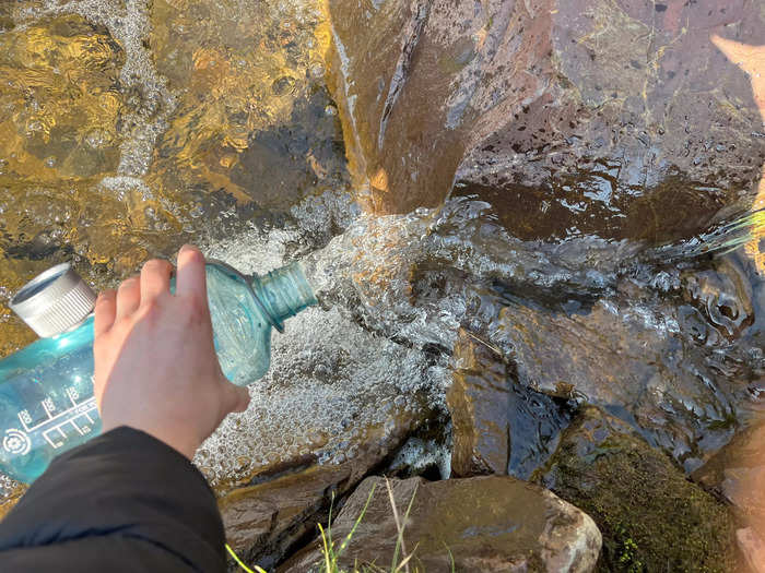 My reusable water bottle came in handy for sampling glacier water during a hike.