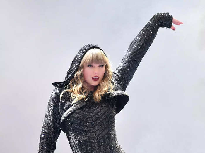 After a few years away from the spotlight, Swift emerged on the Reputation Tour with a new style. One of her famous looks included a black hooded bodysuit and thigh-high boots.