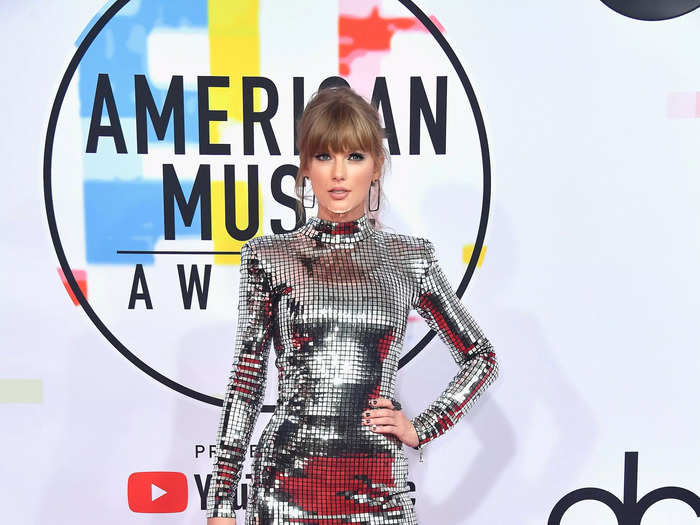 She stunned in a high-necked shiny, silver dress reminiscent of a disco ball at the 2018 American Music Awards.