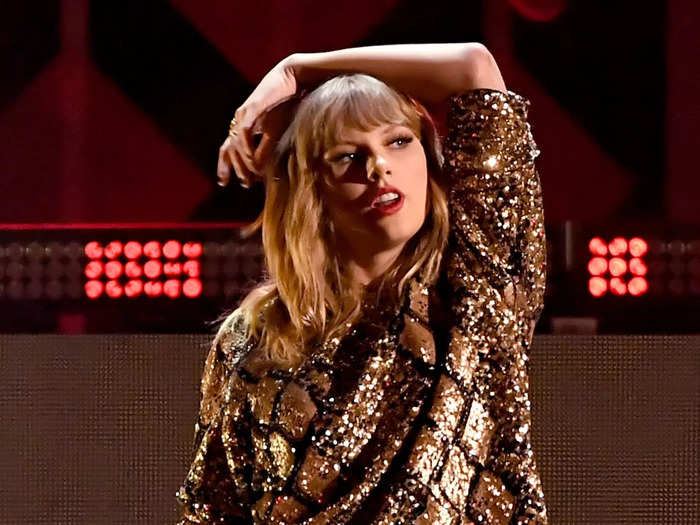 Swift wore a sparkly snakeskin-inspired shirt when she performed at a Jingle Ball 2017.