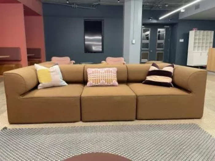 There are even couches, like this brown example decorated with throw pillows.