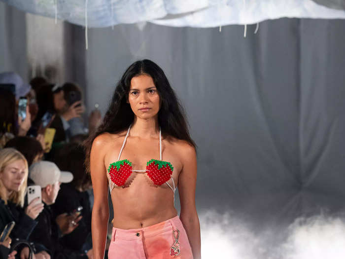 A model at the Helmstedt show rocked a beaded strawberry bralette. Move over, Hailey Bieber; this is the real strawberry girl.