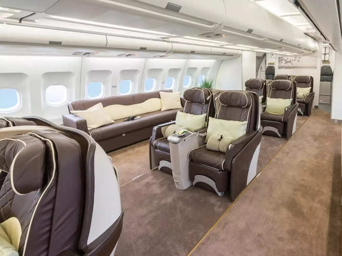 In the back of the plane, guests will find a few rows of more private seats, as well as couches.