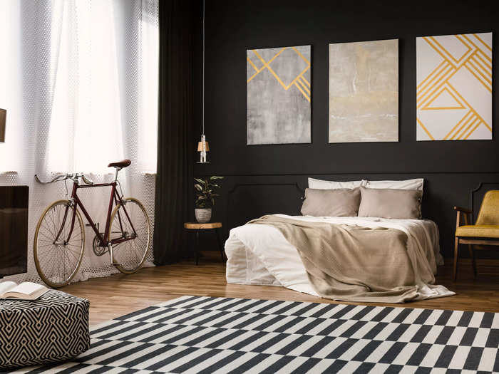 Black absorbs the light – and life – from the bedroom.