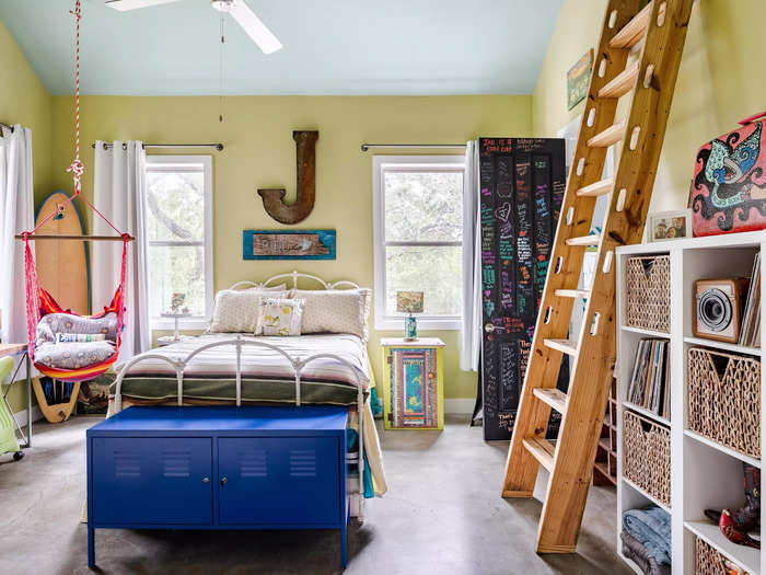 There are also two secondary bedrooms. This vibrant space gives off a teenager vibe.