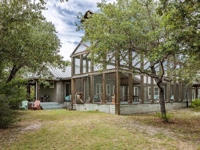 The pinnacle of the property is its screened barn that reaches a towering height of 40 feet. Within the enclosure is an eight-foot-deep pool.