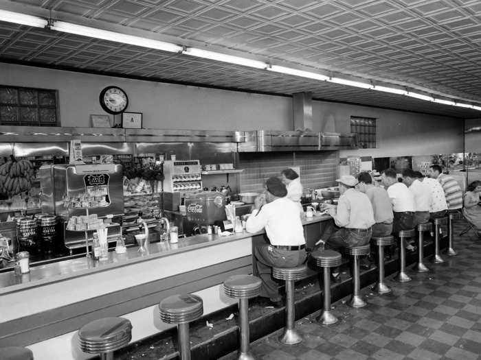 Many diners featured a row of bar stools along a counter, allowing many people to be served without much effort from the diner