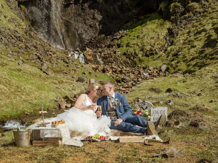 At the foot of a private waterfall, the newlyweds shared a picnic of fruit, macarons, Champagne, and other treats.