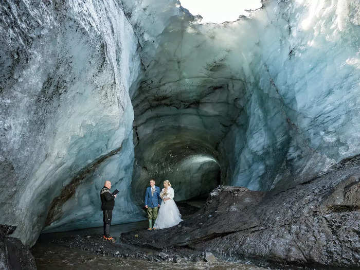 After navigating knee-high rivers flowing through the melting glacier, they arrived at a scenic spot for the ceremony.