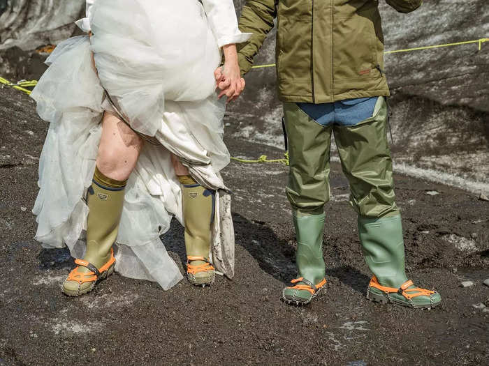 The bride wore white ... and crampons on her rubber boots. The groom wore waders over his suit.