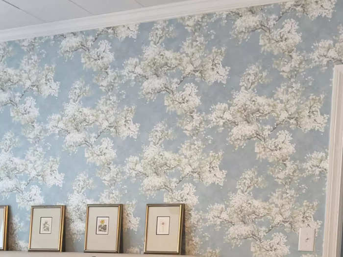 In addition to removing laminate from the home, she added new wallpaper and furniture.