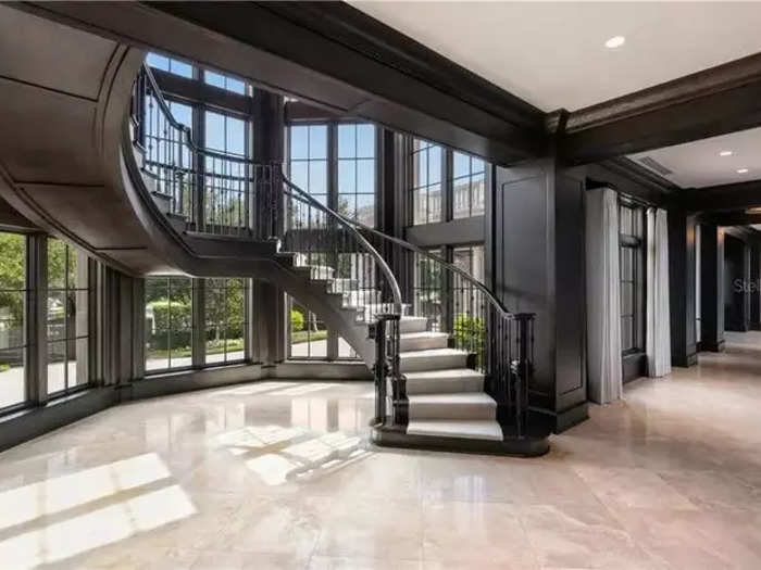 Marble floors and twisting staircases adorned elegant, broad hallways flanked by windows overlooking the property.