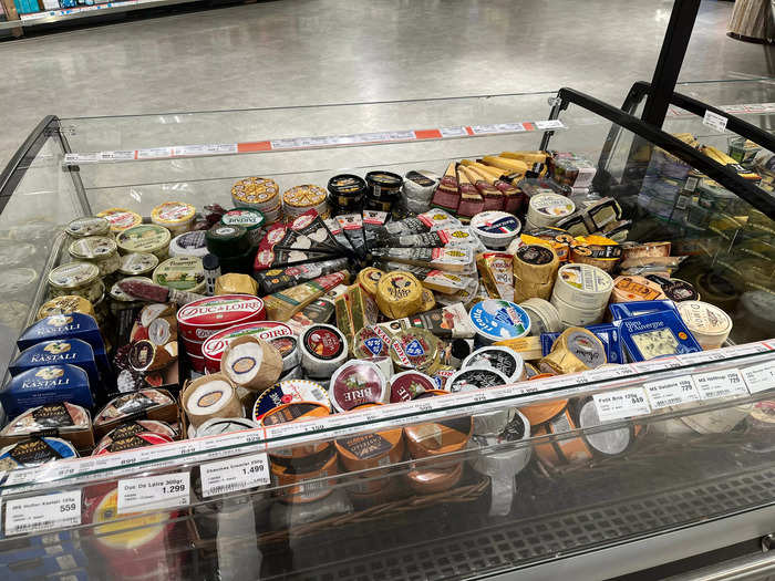 A small cheese section offered wheels of Brie and wedges of Cheddar.