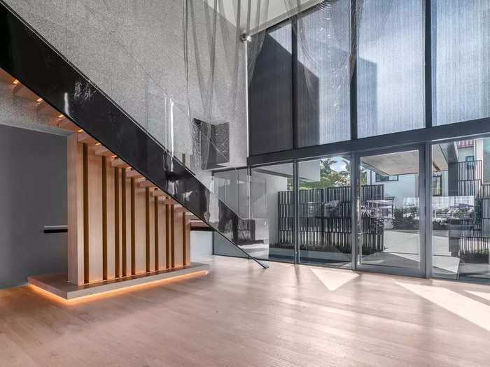 The entire home is very open, with floor-to-ceiling glass windows and doors to let all the Miami sunshine in.