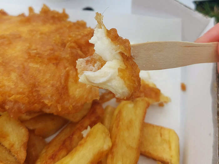 As is customary, we ate our takeout with tiny wooden forks provided by the shop. Some have plastic forks, and some also offer knives, but the traditional way is to eat with one of these impractically small wooden forks. Because the fish was so soft and flaky, it didn