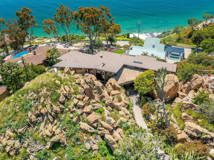 "The challenge was to build into and around the rocks," Grisanti told Insider, as the home sits directly on a "nest" of boulders.