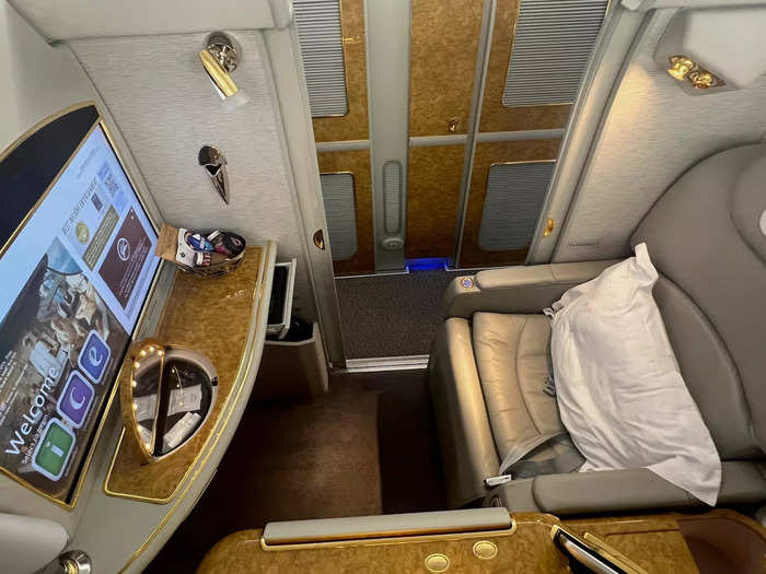 In addition to entertainment, travelers can enjoy an adjustable lounger with lie-flat capabilities. And, sleeping is private thanks to the sliding door.