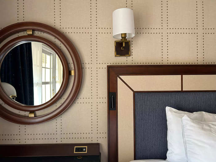 The room featured furniture in dark wood tones with brass accents.