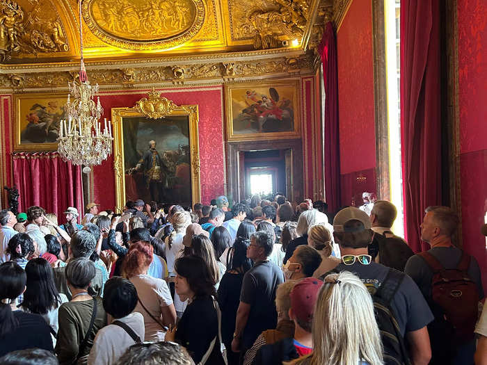 There was only one path toward the great hall, so all visitors moved together through each room, slowly and sweatily creeping from exhibit to exhibit.