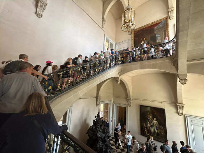 The line heading toward the Hall of Mirrors, one of the palace