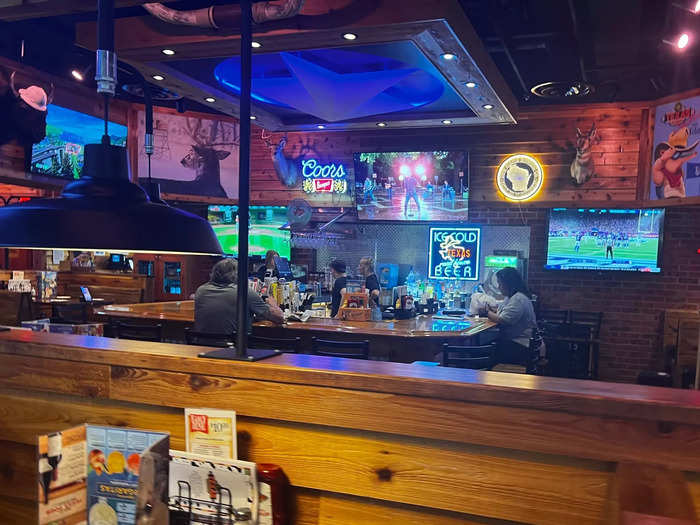 The dining-room ambiance was more New Country than Old Western, with exposed wood and neon signs instead of leather and paintings.