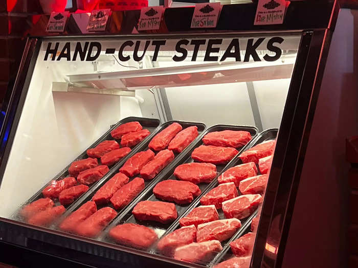 The famous display of hand-cut steaks, which are prepared in-house daily, stood near the entrance.