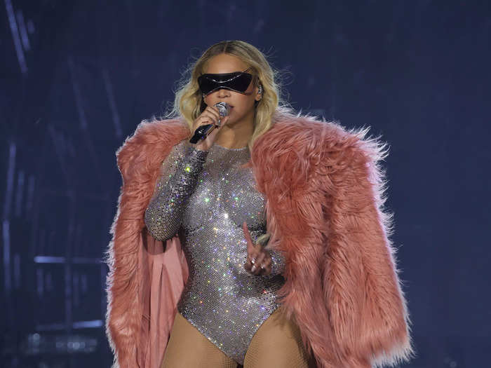 For a July show in East Rutherford, New Jersey, Beyoncé paired a silver bodysuit that featured cone-shaped cups with a pink, faux-fur coat from Philosophy di Lorenzo Serafini.