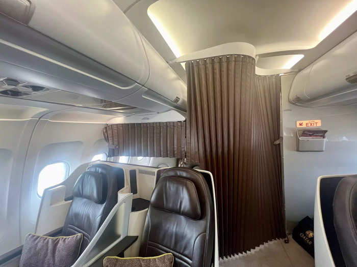 Behind business class, customers with find another lavatory, a closet, and two crew rest seats, all of which are curtained off.