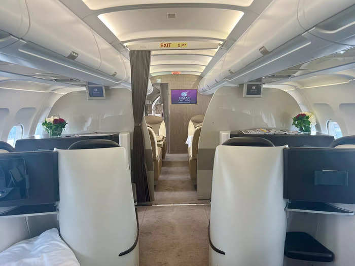 The cabin sports 12 lie-flat beds in a 2x2 layout, meaning they have business-class-like perks but window seat passengers lack direct access to the aisle.