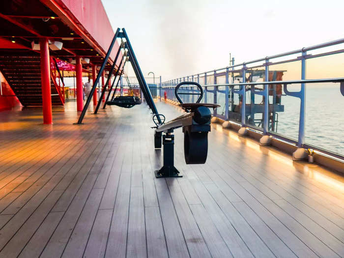 The deck has a playground for adults with gigantic netted swing sets and seesaws.