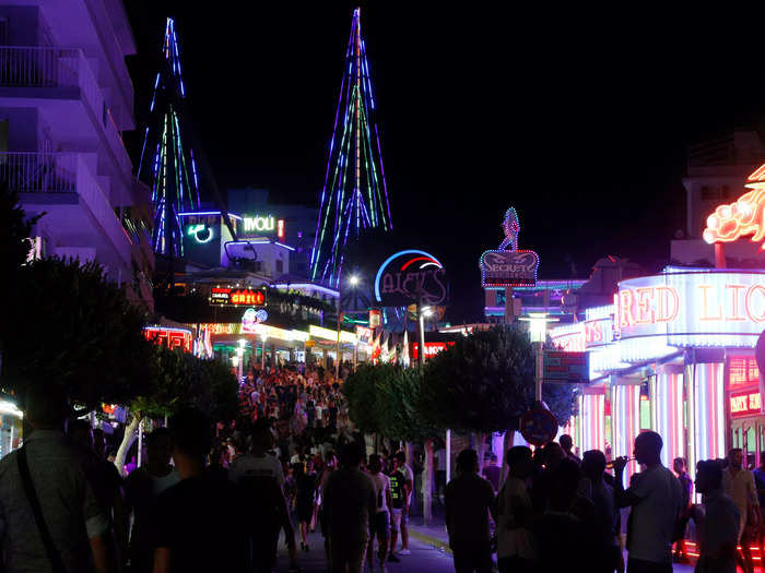 At night, the neon-lined streets of Magaluf became crowded with throngs of tourists looking to party.