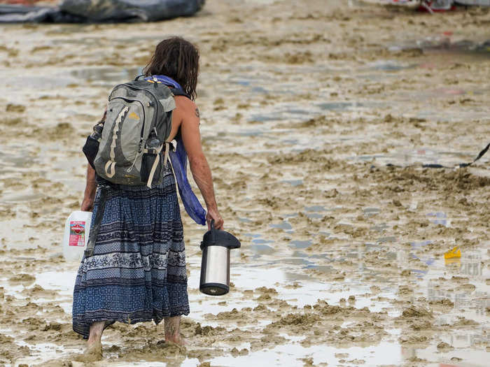 Burning Man advised guests to shelter in place and preserve resources as bad weather continued.