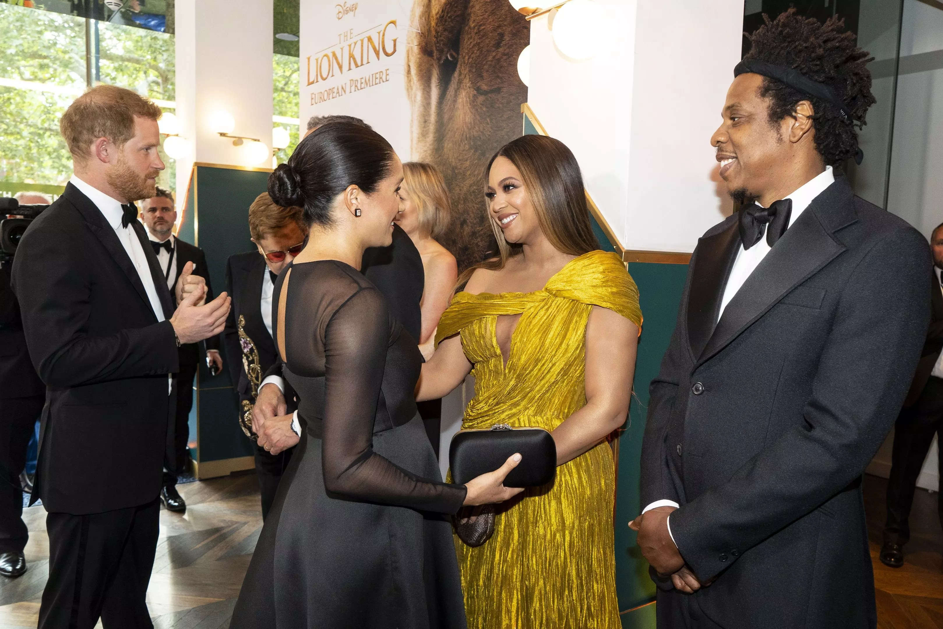 Beyoncé and Jay-Z meet and talk with Prince Harry and Meghan Markle at the premiere of "The Lion King."