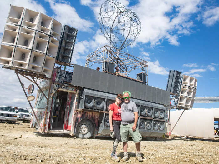 Two longtime burners share an embrace in front of the Robot Heart bus as preparations began for the Man Burn