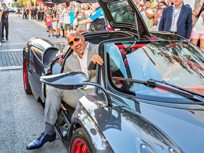 He also buys custom cars. The Rock showed up to the premiere of "Ballers" in a Pagani Huayra.