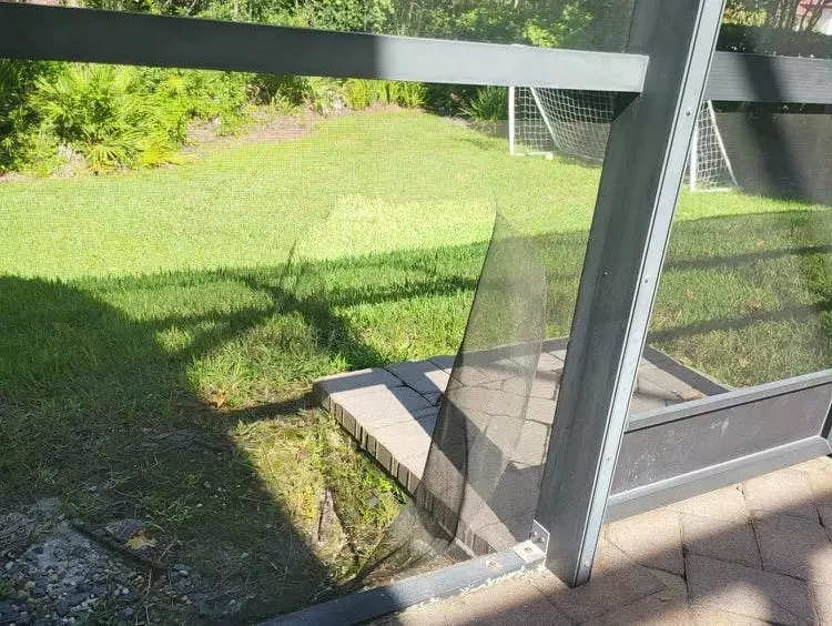 the broken screen of the patio area