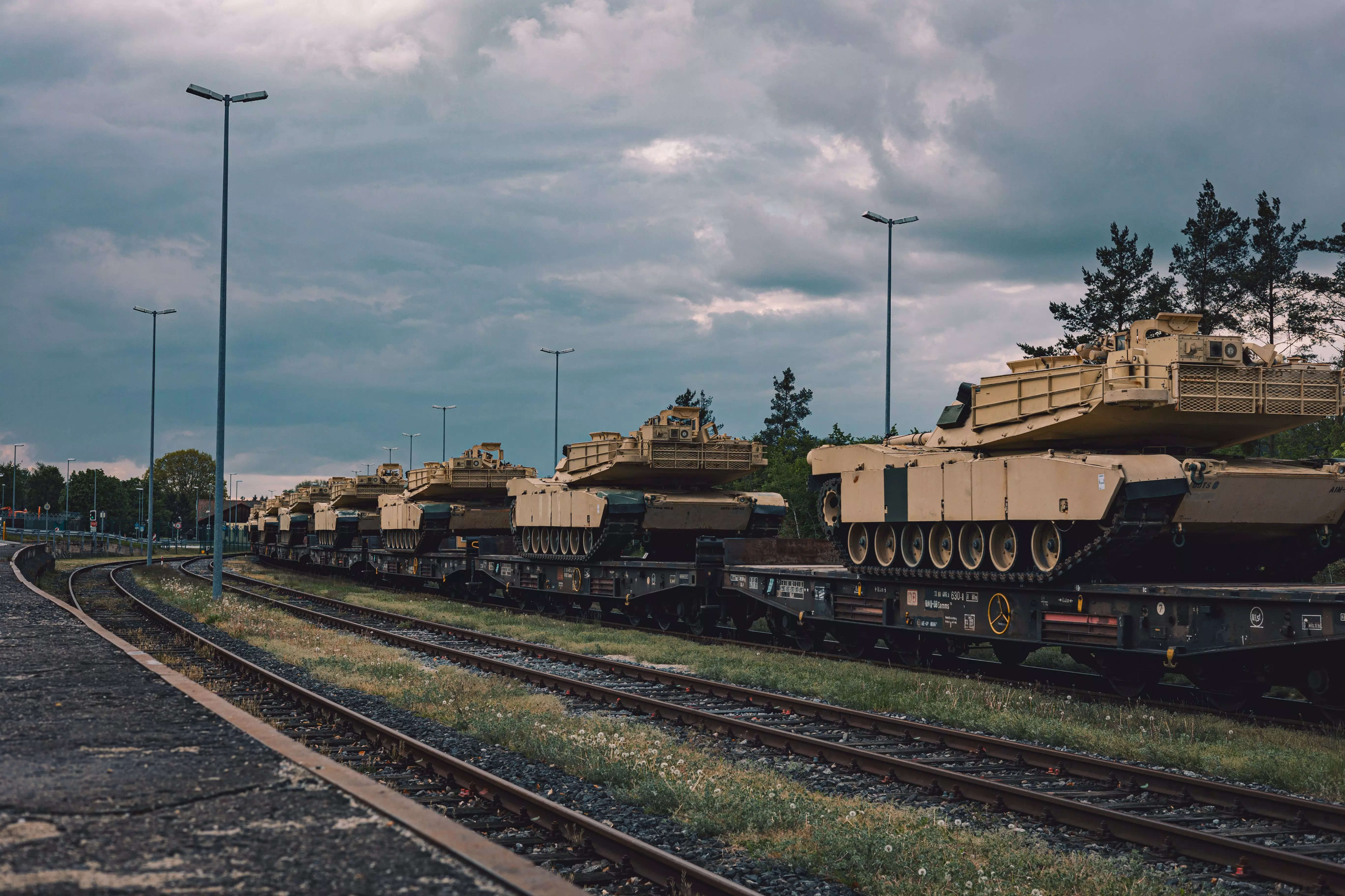 Tanks on rail carriages.