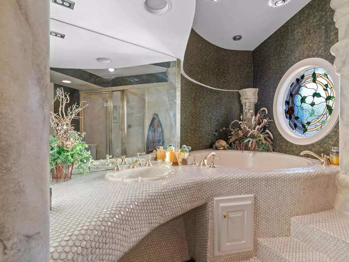 The mansion features what some may describe as unorthodox styles, such as this scaled bathroom with spa-like vibes.