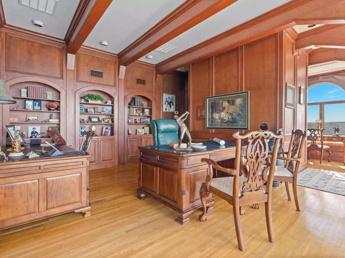 The library and office feature rich-colored wood.